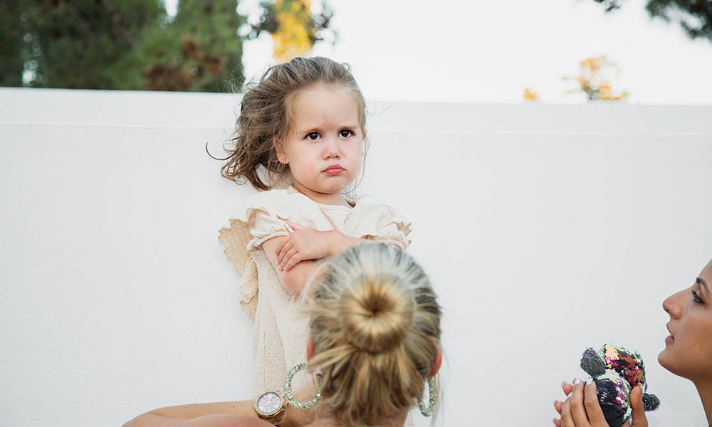 wedding photography - baby refusing to get undressed for the naming ceremony