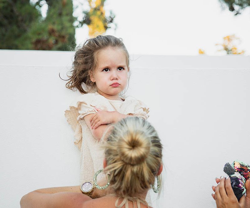 wedding photography - baby refusing to get undressed for the naming ceremony